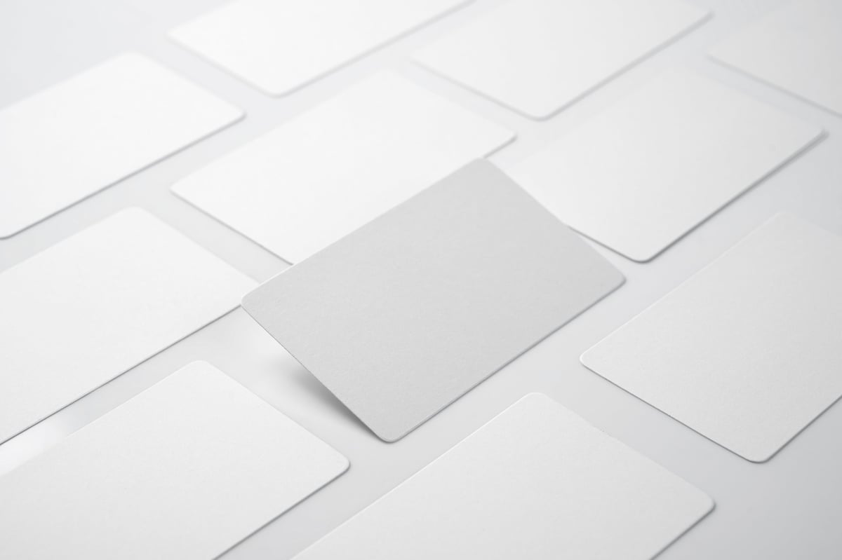 The new wordmark applied across business cards and consultancy documents
