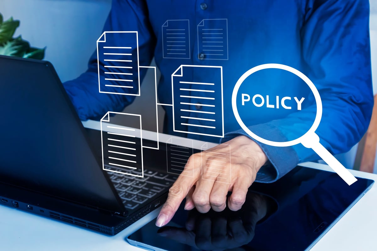 The rewritten policy page shown alongside the rest of the website