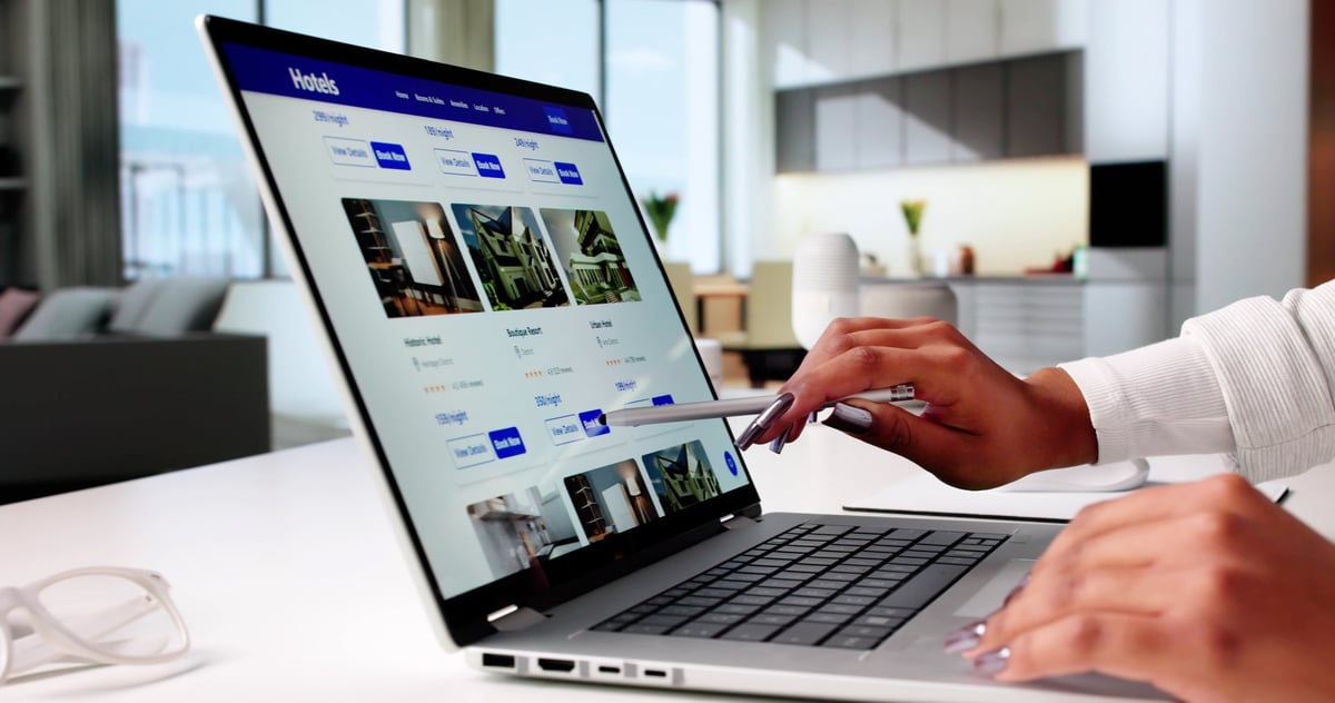 Buyer browsing property listings online on a laptop