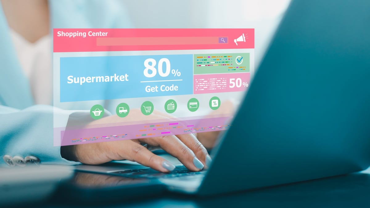 Woman using laptop with ecommerce shopping interface — comparing platform options for online stores