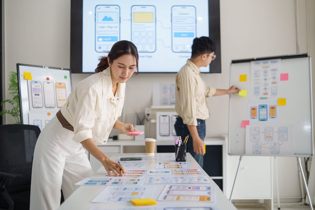 UX designer planning mobile app interface — direct expert collaboration in action