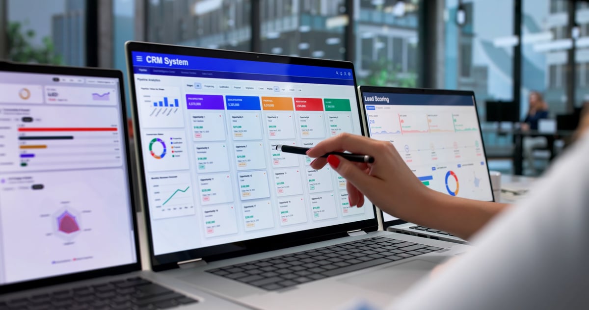 Software product website being reviewed on a laptop screen